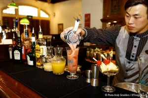 THE MAKING OF THE FAMOUS SINGAPORE SLING COCKTAIL AT THE RAFFLES HOTEL IN SINGAPORE